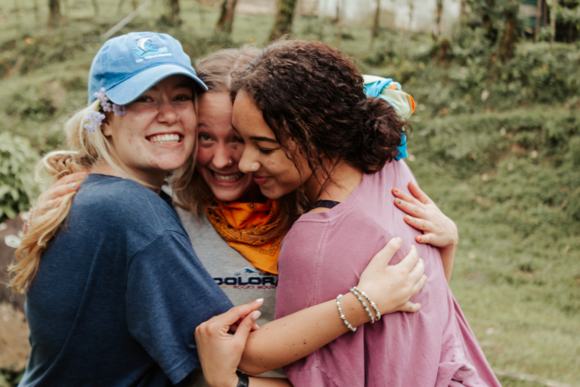 Three students hugging in Costa Rica after serving together