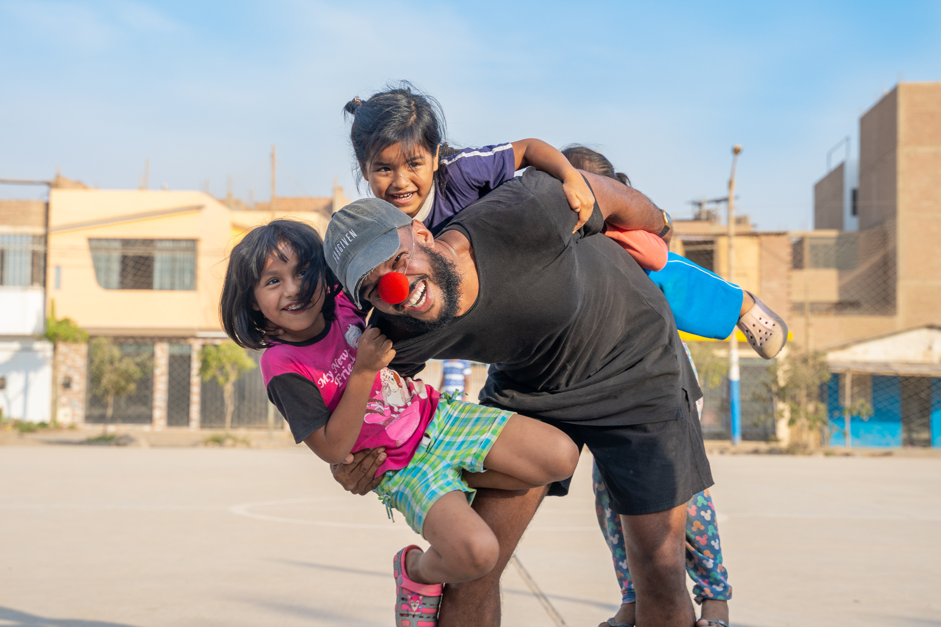 Squad member playing with Peruvian children