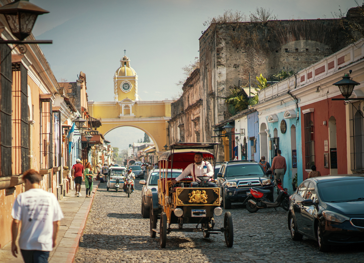 Cobblestone street and yellow arch in Antigua, Guatemala