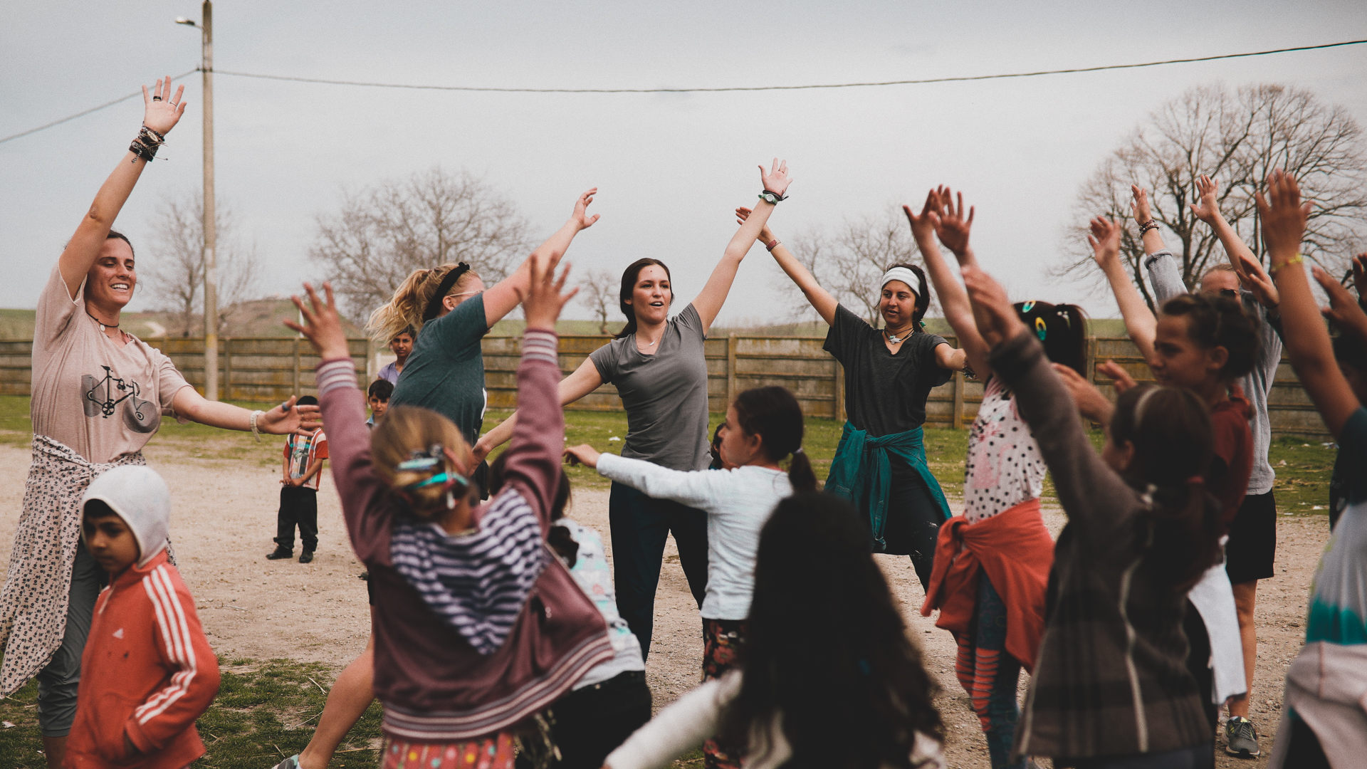 Squad leading a dance circle with Roma village children in Romania