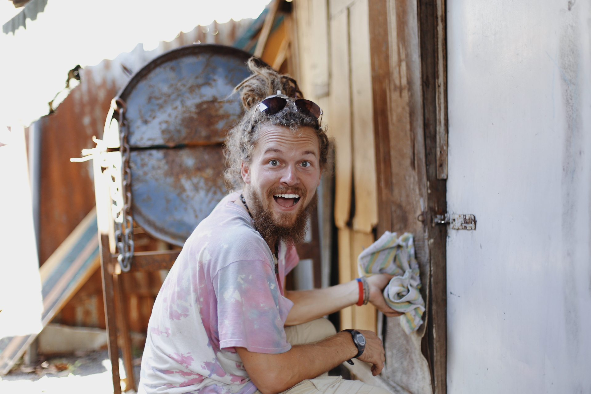 Squad member cleaning and serving outside a home in Costa Rica